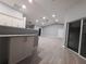 The living room features an open floor plan, granite counters, and vaulted ceilings at 26 Clintwood Ave, Englewood, FL 34223