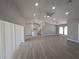 Open-concept living area seamlessly connects the living room and kitchen, with sleek floors and lots of natural light at 26 Clintwood Ave, Englewood, FL 34223