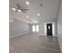 Inviting living room with natural light, sleek floors, and a stylish front door entrance, perfect for gatherings at 26 Clintwood Ave, Englewood, FL 34223