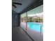 Screened in pool area featuring an in-ground pool with a clear view of the yard and landscaping beyond at 26 Clintwood Ave, Englewood, FL 34223