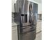 A stainless steel Samsung refrigerator stands out against the white cabinetry at 26 Clintwood Ave, Englewood, FL 34223