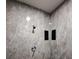 Modern shower stall featuring stylish gray tiling, dual built-in shelves, and sleek fixtures at 26 Clintwood Ave, Englewood, FL 34223