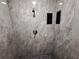 This modern shower features a stylish tile surround, sleek fixtures, and integrated storage at 26 Clintwood Ave, Englewood, FL 34223