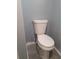 Close-up of a standard white toilet, newly installed in a remodeled bathroom at 26 Clintwood Ave, Englewood, FL 34223