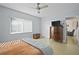 Serene bedroom with a neutral color palette, tiled floors, a ceiling fan, and ample natural light at 2850 41St N St, St Petersburg, FL 33713