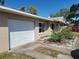 Charming home with a well-maintained lawn and attached garage at 2850 41St N St, St Petersburg, FL 33713