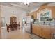 Bright kitchen with stainless steel fridge and nearby dining area at 2850 41St N St, St Petersburg, FL 33713