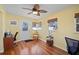 Bright office space featuring hardwood floors, a ceiling fan, and natural light from multiple windows at 2850 41St N St, St Petersburg, FL 33713