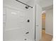 Updated shower with modern fixtures and door to hall at 2850 41St N St, St Petersburg, FL 33713