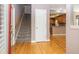 The foyer of this home features a staircase and gorgeous wood floors at 2880 Bayshore Trails Dr, Tampa, FL 33611