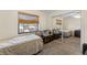 Bedroom featuring a neutral color palette, a window, a ceiling fan and mirrored closet at 3442 Beech Trl, Clearwater, FL 33761