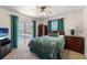 A beautiful bedroom with direct access to the pool, offering a luxurious and relaxing atmosphere at 3442 Beech Trl, Clearwater, FL 33761