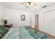 A well-lit bedroom with a view of the hallway and closet, provides comfortable and functional living space at 3442 Beech Trl, Clearwater, FL 33761