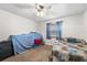 A cozy bedroom with a bed, carpet, and a ceiling fan offers a comfortable retreat at 3442 Beech Trl, Clearwater, FL 33761