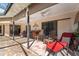 Comfortable covered patio with ceiling fans, a bar, and ample seating for relaxing or entertaining guests at 3442 Beech Trl, Clearwater, FL 33761