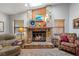 Close up of a beautiful stone fireplace with wood accents, adding warmth and character to the living space at 3442 Beech Trl, Clearwater, FL 33761