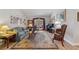 Cozy living room with hardwood floors, natural light, comfortable seating, and a view of the backyard at 3442 Beech Trl, Clearwater, FL 33761