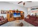 Bright living room with an entertainment center, comfortable seating and decor at 3442 Beech Trl, Clearwater, FL 33761