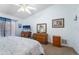 Bright main bedroom featuring wood furniture, comfortable bedding, and ample natural light at 3442 Beech Trl, Clearwater, FL 33761