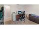 Office space including a desk, office chair, drawers, storage and light from the window at 3442 Beech Trl, Clearwater, FL 33761