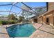 Enjoy the sun with a refreshing backyard pool, brick pavers and fully screened lanai for outdoor enjoyment at 3442 Beech Trl, Clearwater, FL 33761