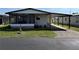 Charming single-story home featuring a carport, screened porch, and well-maintained landscaping at 37542 Pinata Ave, Zephyrhills, FL 33541
