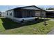 Charming single-story home featuring a carport, screened porch, and well-maintained landscaping at 37542 Pinata Ave, Zephyrhills, FL 33541