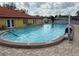 This community pool offers residents a place to cool off with chairs for lounging at 37542 Pinata Ave, Zephyrhills, FL 33541