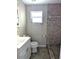 Bathroom with a tiled shower, white vanity and modern fixtures at 3905 W Carmen St, Tampa, FL 33609