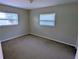 Bedroom featuring carpet floors and natural light at 3905 W Carmen St, Tampa, FL 33609