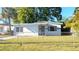 Charming single-story home with a well-maintained lawn and landscaping at 3905 W Carmen St, Tampa, FL 33609