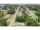 A clear aerial view of the house nestled in a neighborhood with tree-lined streets, showcasing a peaceful community setting at 4005 W Nassau St, Tampa, FL 33607