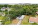 An aerial view of the home showcasing its updated roof and landscaping at 4005 W Nassau St, Tampa, FL 33607