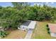 An aerial view of the home showcasing its updated roof and landscaping at 4005 W Nassau St, Tampa, FL 33607