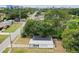 Overhead shot of the house showing the proximity to other homes in the neighborhood and the surrounding mature trees at 4005 W Nassau St, Tampa, FL 33607
