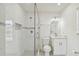 Updated bathroom featuring a glass-enclosed shower with elegant marble-style tiling and modern fixtures at 4005 W Nassau St, Tampa, FL 33607