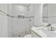 Modern bathroom with walk-in shower with marbled tile and a contemporary vanity at 4005 W Nassau St, Tampa, FL 33607