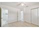A bright bedroom leads to an updated bathroom with glass shower and marble-style tiling at 4005 W Nassau St, Tampa, FL 33607