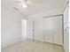 Cozy bedroom with light flooring and an integrated closet, providing a bright and tidy space at 4005 W Nassau St, Tampa, FL 33607