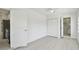 Bedroom features a closet and an adjacent utility room with a washer and dryer at 4005 W Nassau St, Tampa, FL 33607