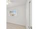 Bedroom features light floors, a window, and a white door at 4005 W Nassau St, Tampa, FL 33607