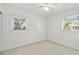 Bedroom featuring dual windows providing ample light and modern light-colored flooring at 4005 W Nassau St, Tampa, FL 33607