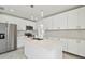 Updated kitchen featuring an island with a sink, stainless steel appliances, and modern pendant lighting at 4005 W Nassau St, Tampa, FL 33607
