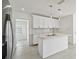Bright, updated kitchen featuring quartz countertops, and stainless steel appliances at 4005 W Nassau St, Tampa, FL 33607