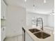 Kitchen island with double sinks, stylish faucet, and ample counter space for cooking at 4005 W Nassau St, Tampa, FL 33607