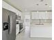 Renovated kitchen showcasing stainless steel appliances, bright interiors, and modern design at 4005 W Nassau St, Tampa, FL 33607