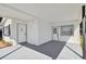 The covered porch has freshly painted brick and concrete, and two entry doors at 4005 W Nassau St, Tampa, FL 33607