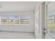 Bright sunroom featuring multiple windows, providing ample natural light and inviting views at 4005 W Nassau St, Tampa, FL 33607