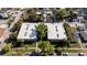 Aerial view of a condo building showing roof, surrounding trees, and greenery at 426 32Nd N Ave # 102E, St Petersburg, FL 33704