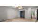 Bedroom with wood-look floors, standard closet, and neutral paint at 426 32Nd N Ave # 102E, St Petersburg, FL 33704